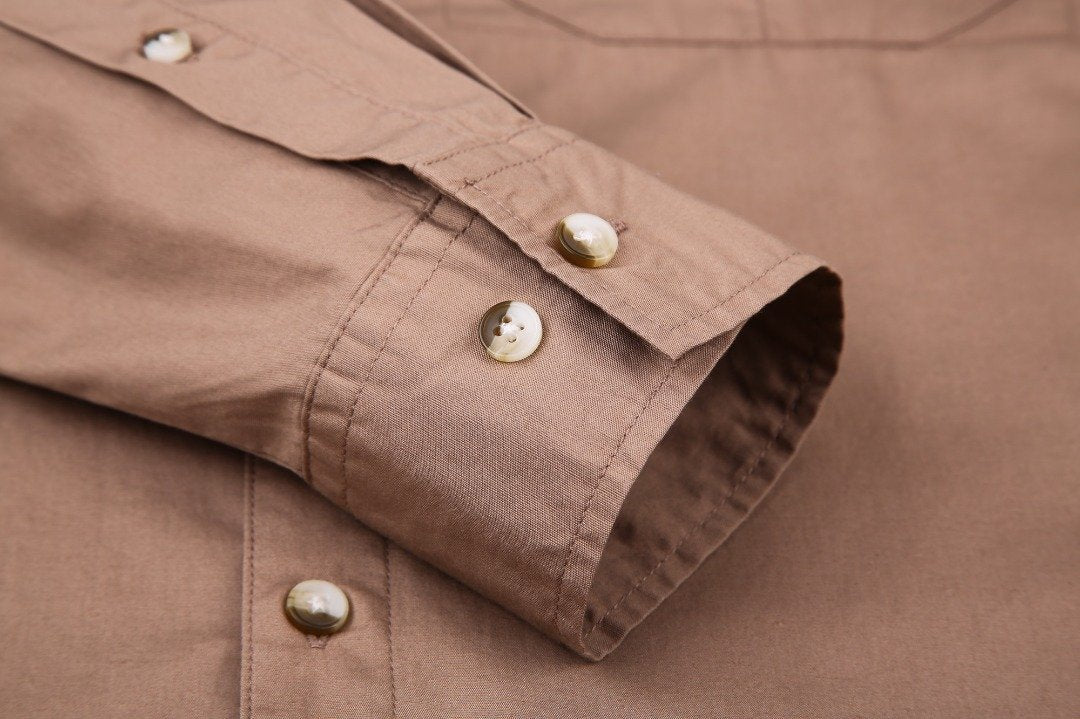Khaki fishing shirt with buttons on the cuffs.