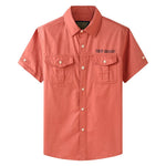 Orange button-up work shirt. Short sleeve. Off-road text above left chest.