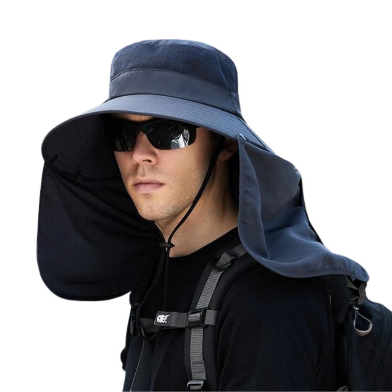 Our Detachable Flap Fishing Hat in Navy being worn by a male model wearing sunglasses and a backpack. 