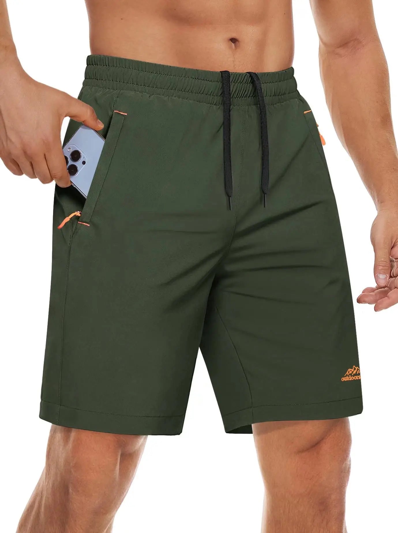Green sports shorts worn by a man on a white background.