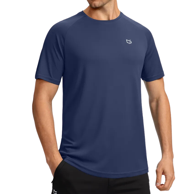 Athletic male wearing a navy blue sports t-shirt with the g Gradual logo on chest.