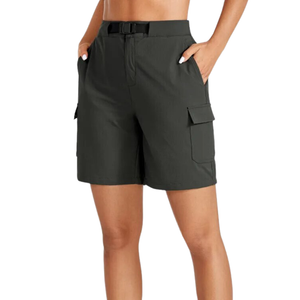 Female wearing a dark green pair of waterproof hiking shorts with a 7 inch inseam.
