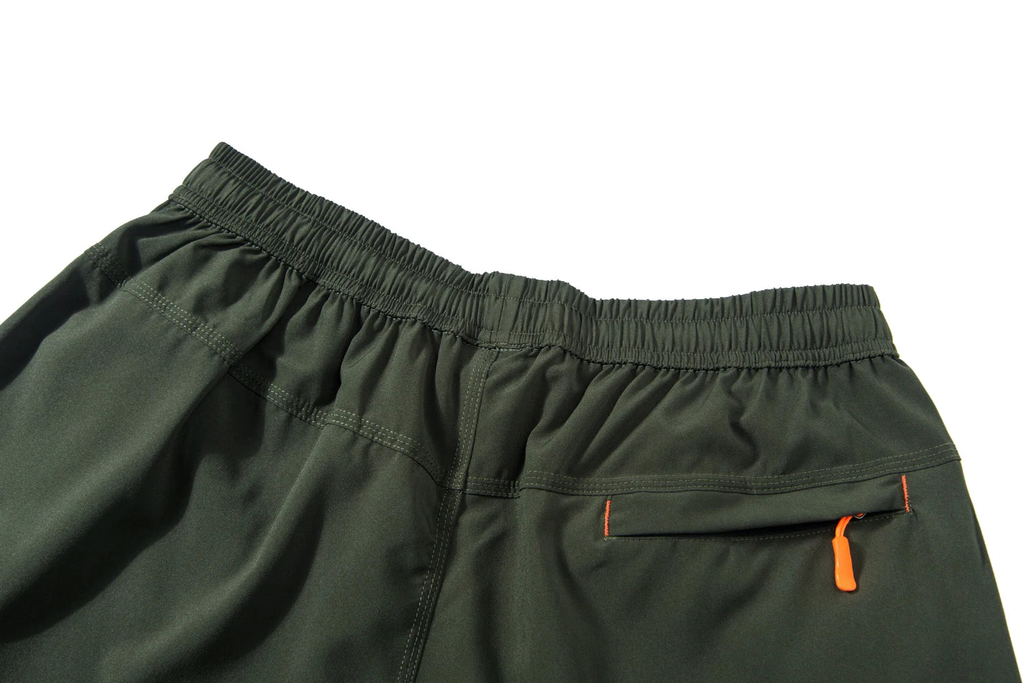 Green shorts with orange zippers on a white background.