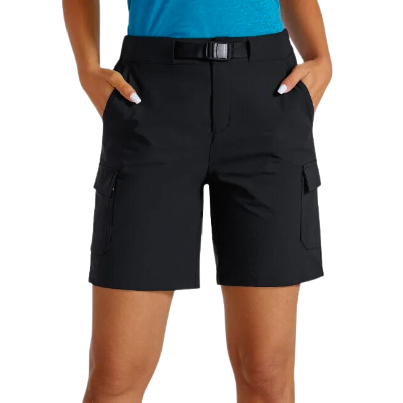 Female model wearing a pair of black hiking shorts that have multiple pockets and a built in belt. The shorts are lightweight and quick drying.