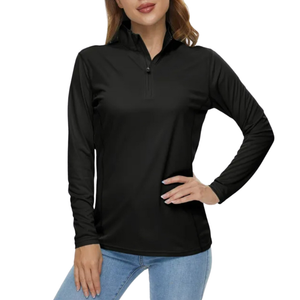 Female model wearing a black long sleeve sun protection shirt with a quarter zip-up-collar. This shirt is made from UPF 50+ cloth.