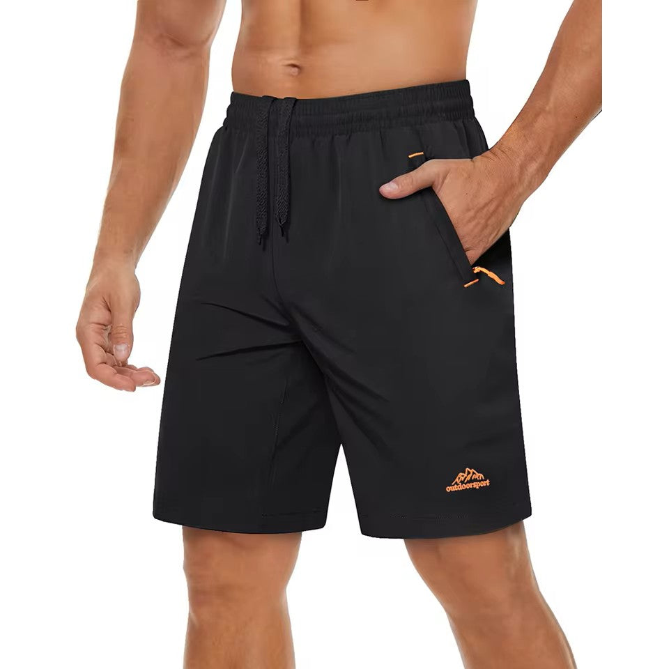 Black shorts with orange accents on a white background.