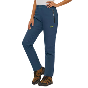 A top selling dark blue pair of women's waterproof fleece pants being modelled with a pair of brown hiking boots.
