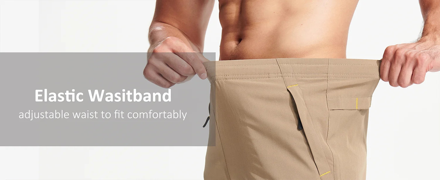 Beige shorts with an elastic waistband feature on a grey background.