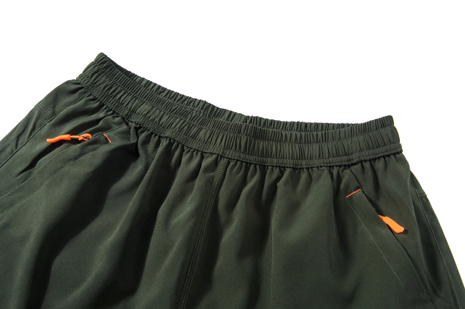 Green shorts with orange zippers on a white background.