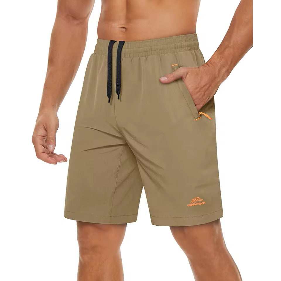 Male model wearing Beige or Khaki shorts with a Outdoor sports logo on a white background.