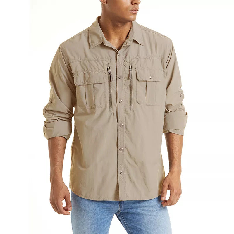 Man wearing a Khaki button-up fishing shirt that also has zip pockets on the chest.