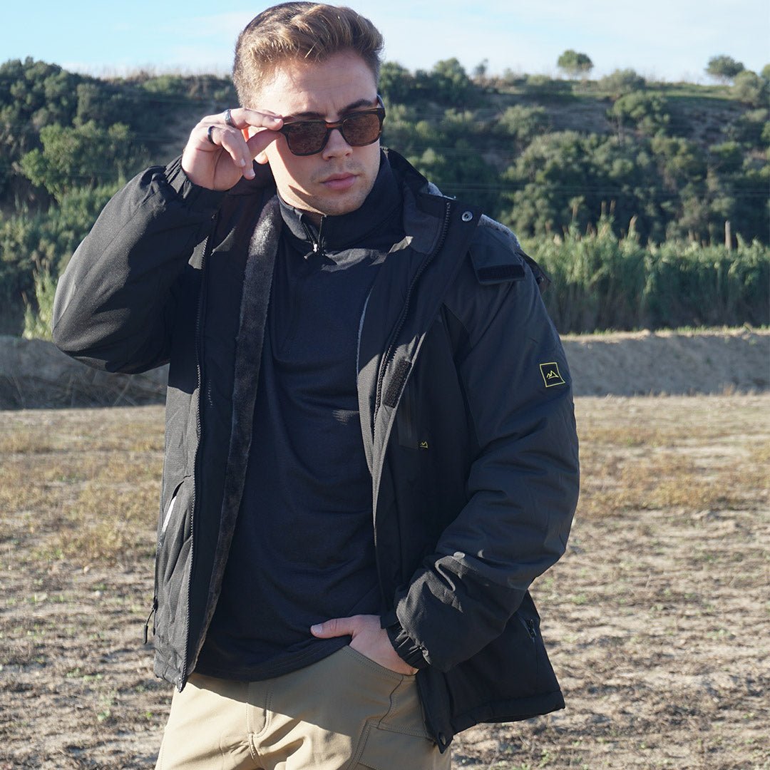 Male model wearing a black waterproof fleece lined jacket and sunglasses.