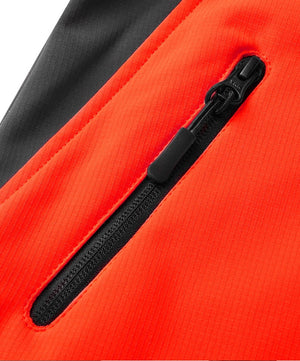 Quality YKK zips on women's orange jacket.