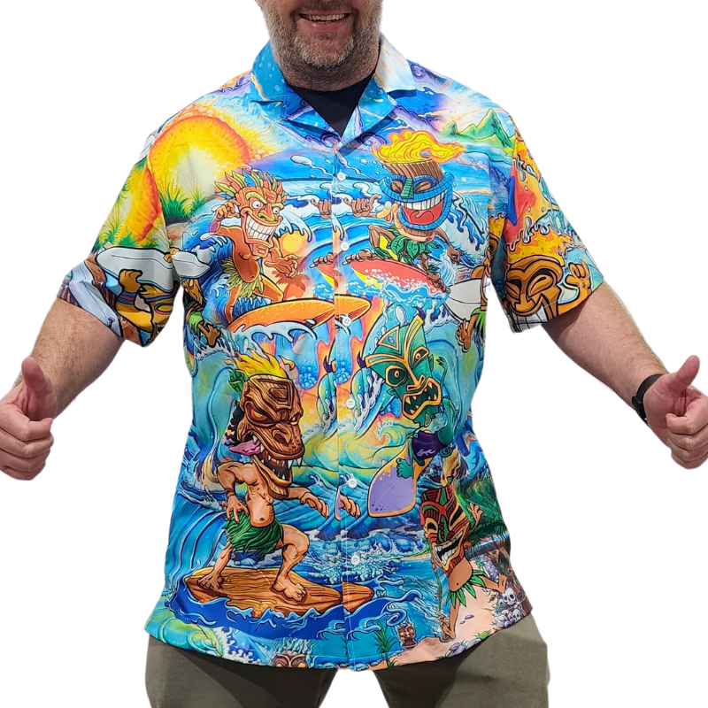 Male model wearing a bright coloured tiki style Hawaiian shirt. 