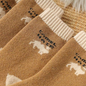 Camel hair socks for men and women. Warm and thick. Brown and cream fabric.