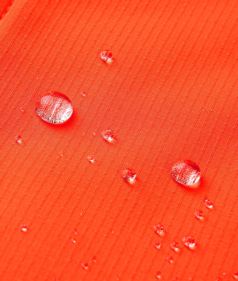 Orange water repellent membrane on women's outdoor jacket. 