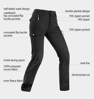 Women's outdoor trekking pants with a range of features being displayed such as zip pockets, elastic waistband and waterproof material.