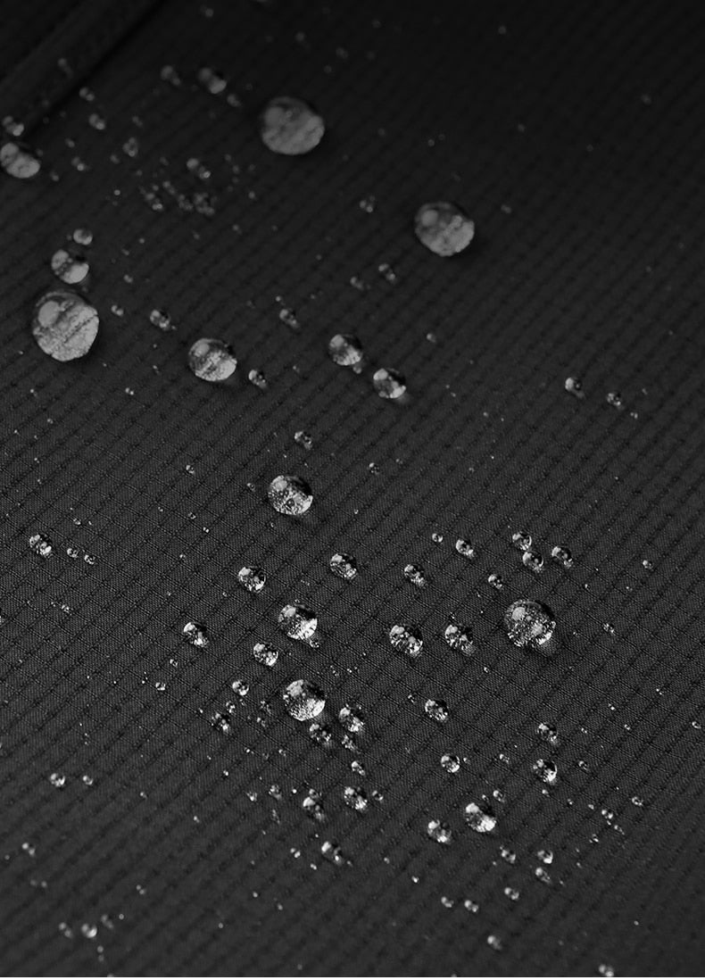 Water droplets on top of waterproof cloth used to make women's hiking pants.