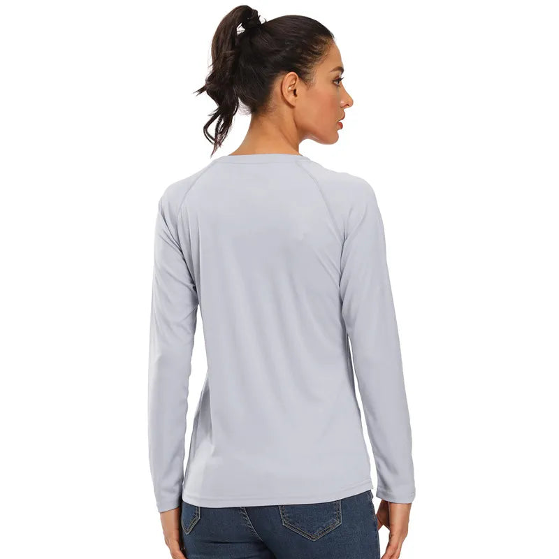 Back profile of the Women's Light Grey UPF 50+ Long Sleeve T-Shirt being worn by a female model with dark blue denim jeans on.