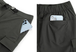 A pair of women's hiking shorts with multiple pockets laid flat.