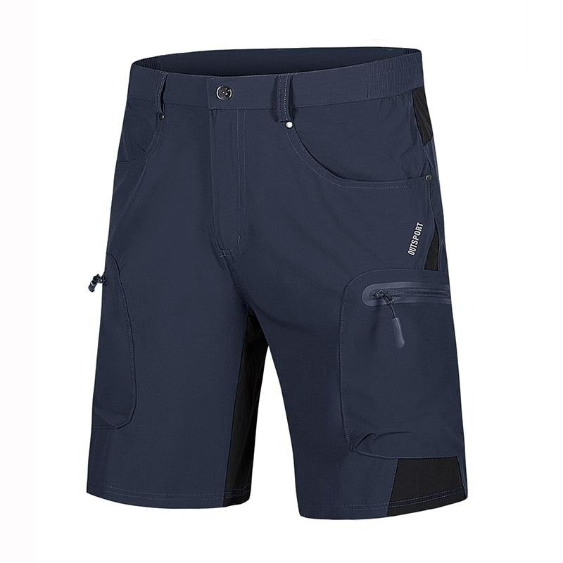A pair of navy shorts that you can buy from Guts Fishing Apparel. The shorts have multiple pockets. Some pockets have zips and the shorts are made from quick drying nylon and polyester cloth.