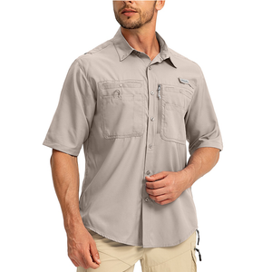 Man wearing a short sleeve button-up fishing shirt with lots of pockets and utility features.. 