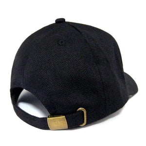 Adjustable strap on the back of a black hat.