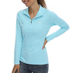 Female model wearing a light blue sun protection shirt with zip up collar and long sleeve. The cloth has a UPF 50+ sun protection rating. 