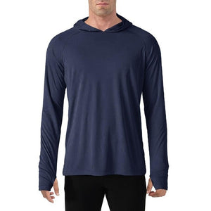 Man wearing navy long sleeve shirt that has a hood for sun protection. The cuffs of the sleeves also have thumb holes to help cover the back of your hands. 