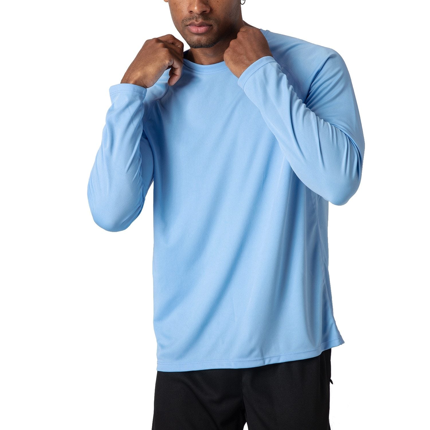 Male model wearing a sky blue, long sleeve t-shirt for sun protection.