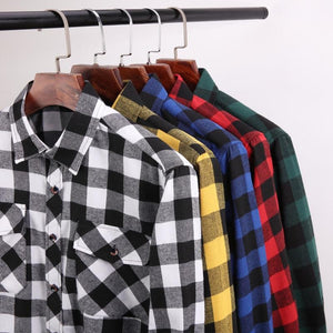 Plaid Flannel Shirts displayed on clothing rack. The shirt colours are white, yellow, blue, red and green.