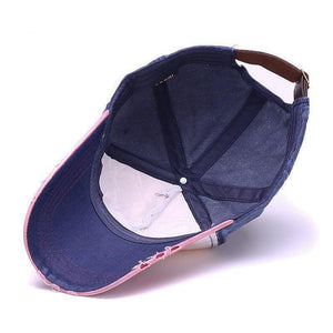 Inside of men's blue baseball style cap with leather strap on back for adjusting the size.