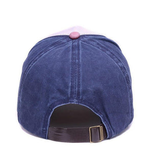 Men's baseball style cap with Bordeaux squatchee or squatcho on top. The cap has a blue crown and an adjustable leather strap on the back.