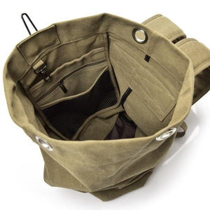 Inside view of the Khaki Canvas Rucksack with three internal pockets and d-ring.