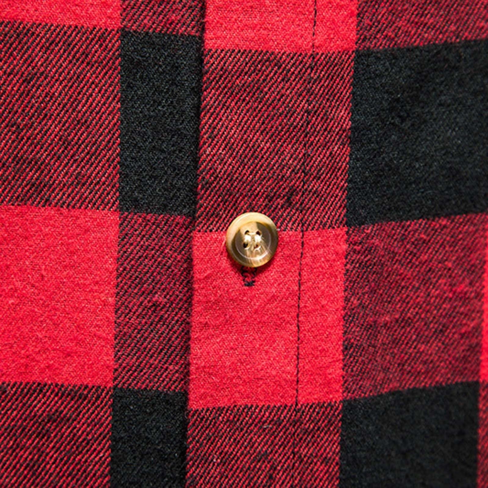 Two tone buttons on red flannelette shirt.