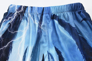 Thunderbolt and lightening design on the back of a blue pair of fishing pants.