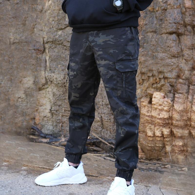 Men's black jogger pants with zip pockets and cargo pockets. 