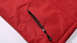 Waterproof zip pockets on red jacket.