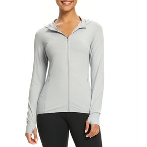 Female model wearing a light grey zip-up sun protection shirt with a UPF 50 + rating. The shirt has long sleeve and a hood.
