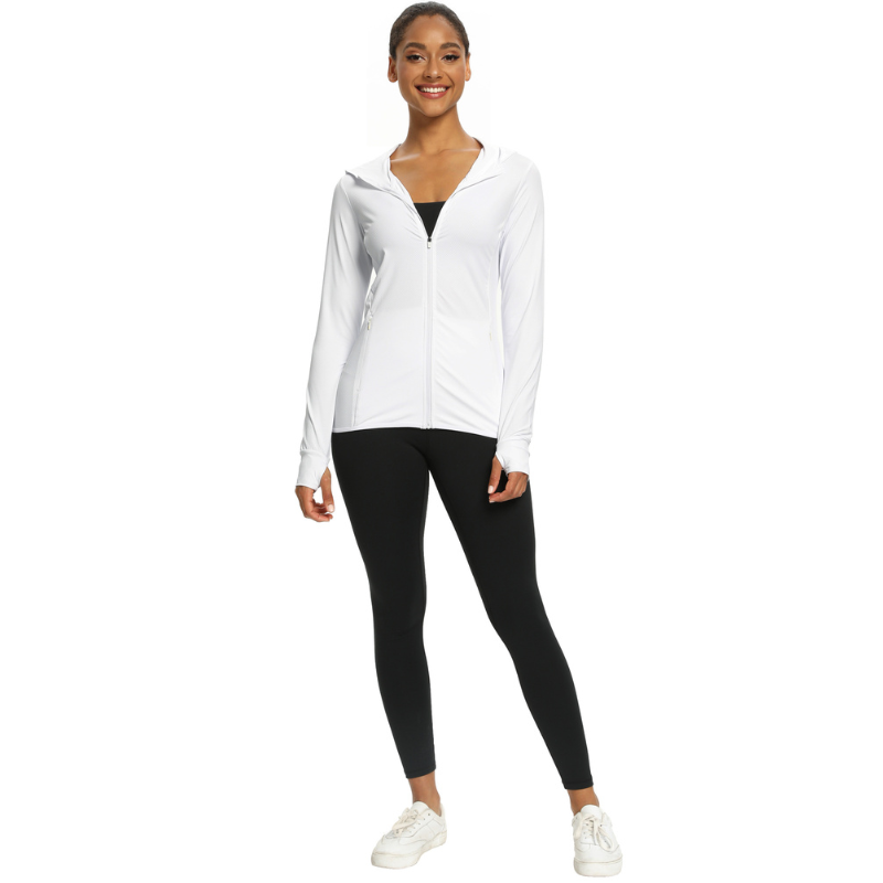White long sleeve hooded sun shirt being modelled by a female in black tights and white shoes.