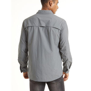 Male wearing a grey button up long sleeve shirt that has ventilation opening on the back that helps circulate the air keeping you nice and cool.