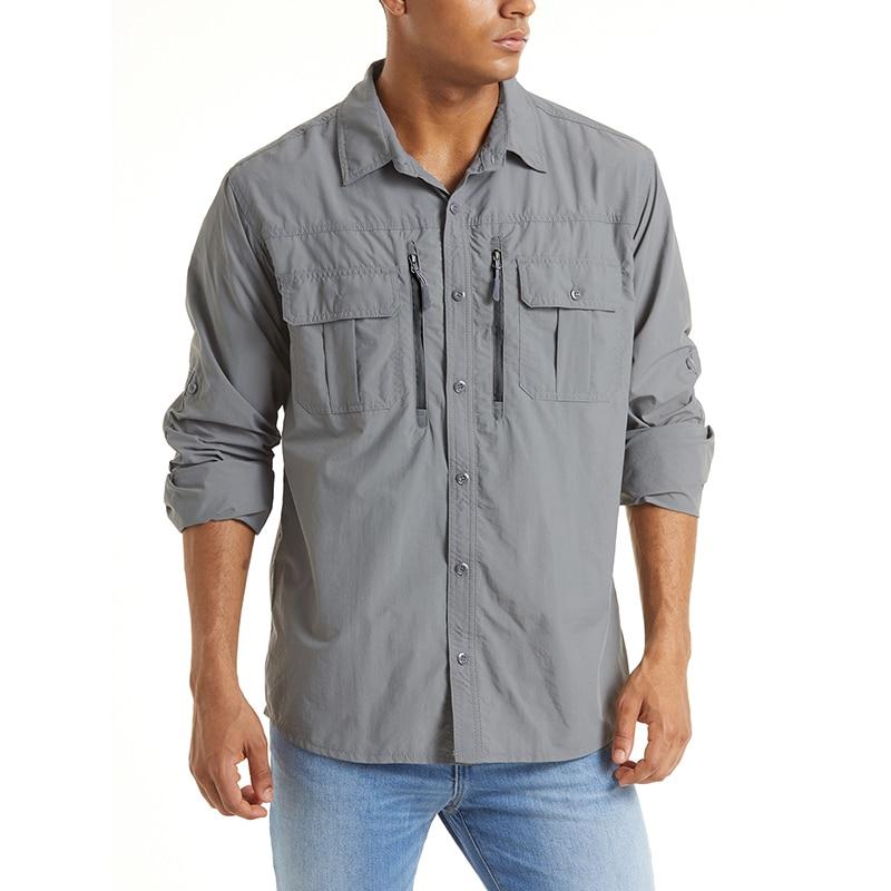 Men's grey button-up work shirt. It has two zip pockets, long sleeves and a moisture wicking polyester lining.
